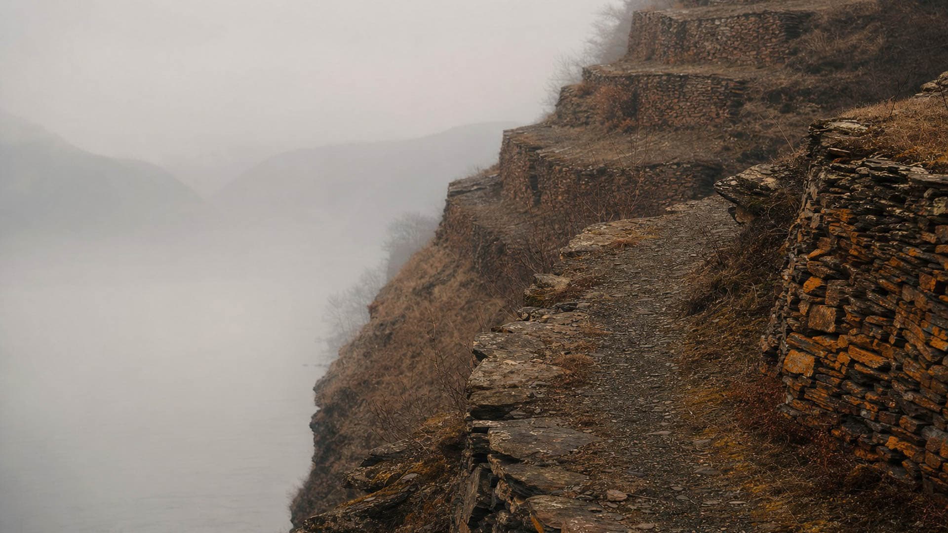 Terraced slate river valley in morning mist
