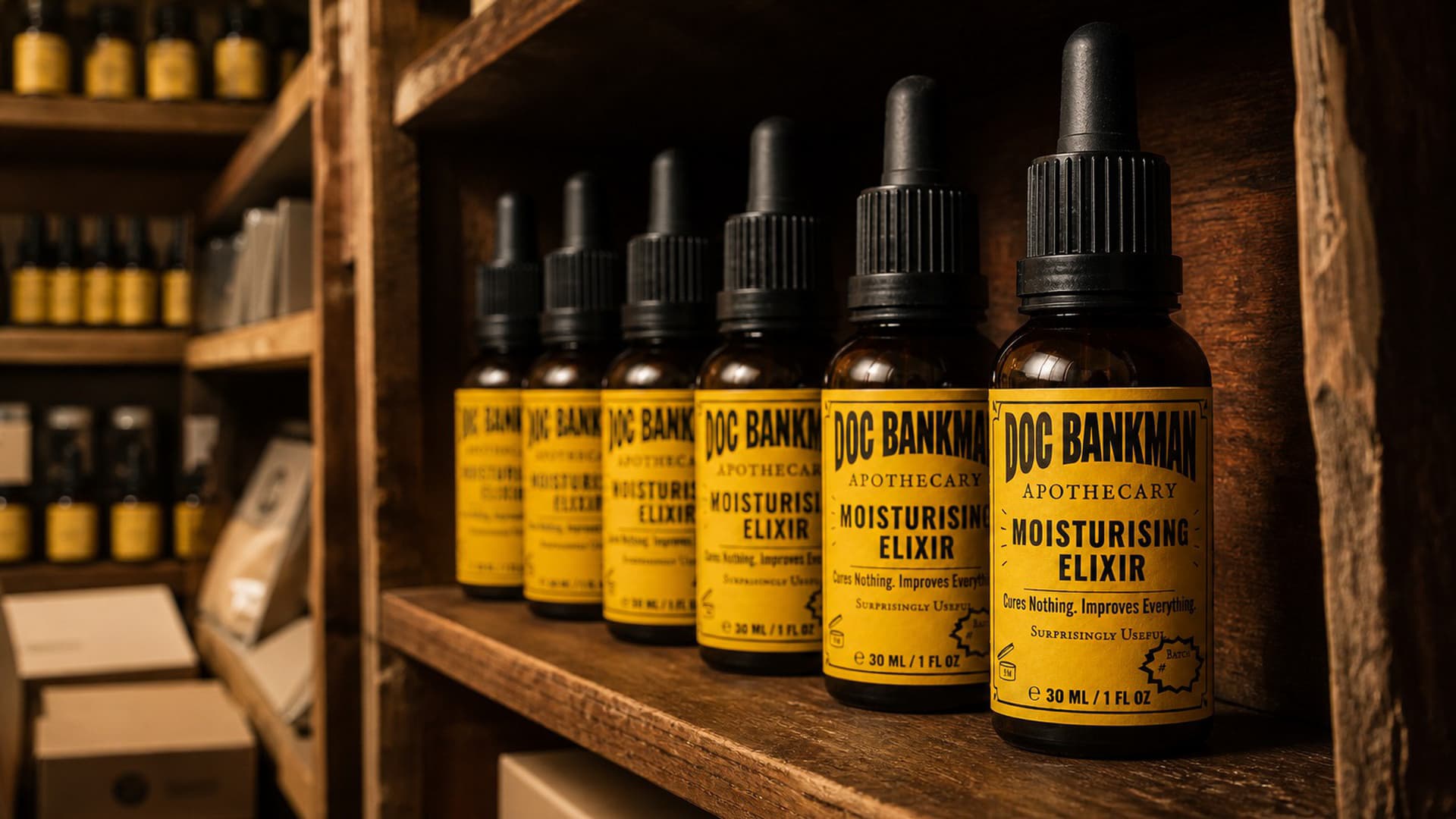 Bottles of the current label lined on a shelf, studio frame
